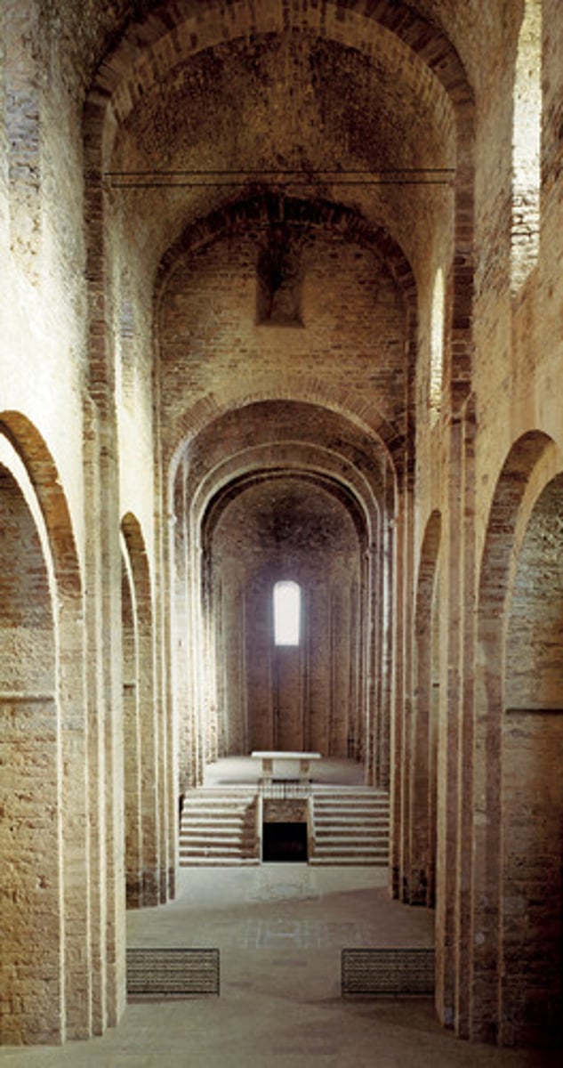 <p>a vertical section of a church that is embraced by a set of columns and is usually composed of arches and aligned windows</p>