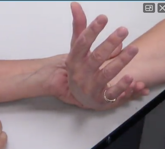 "Keeping your fingers relaxed, can you bring your wrist up towards the ceiling" 