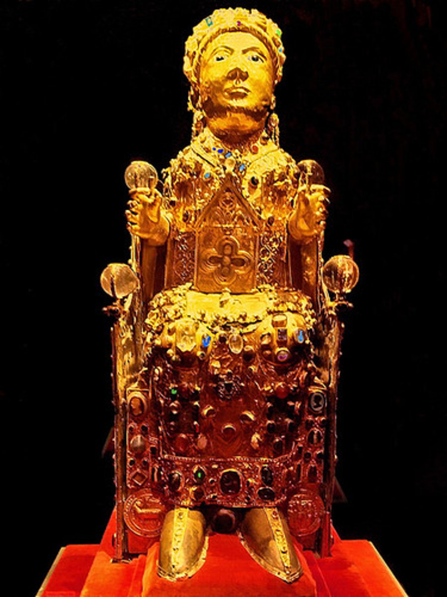 <p>a vessel for holding a sacred relic. Often reliquaries took the shape of the objects they held. Precious metals and stones were the common material</p>