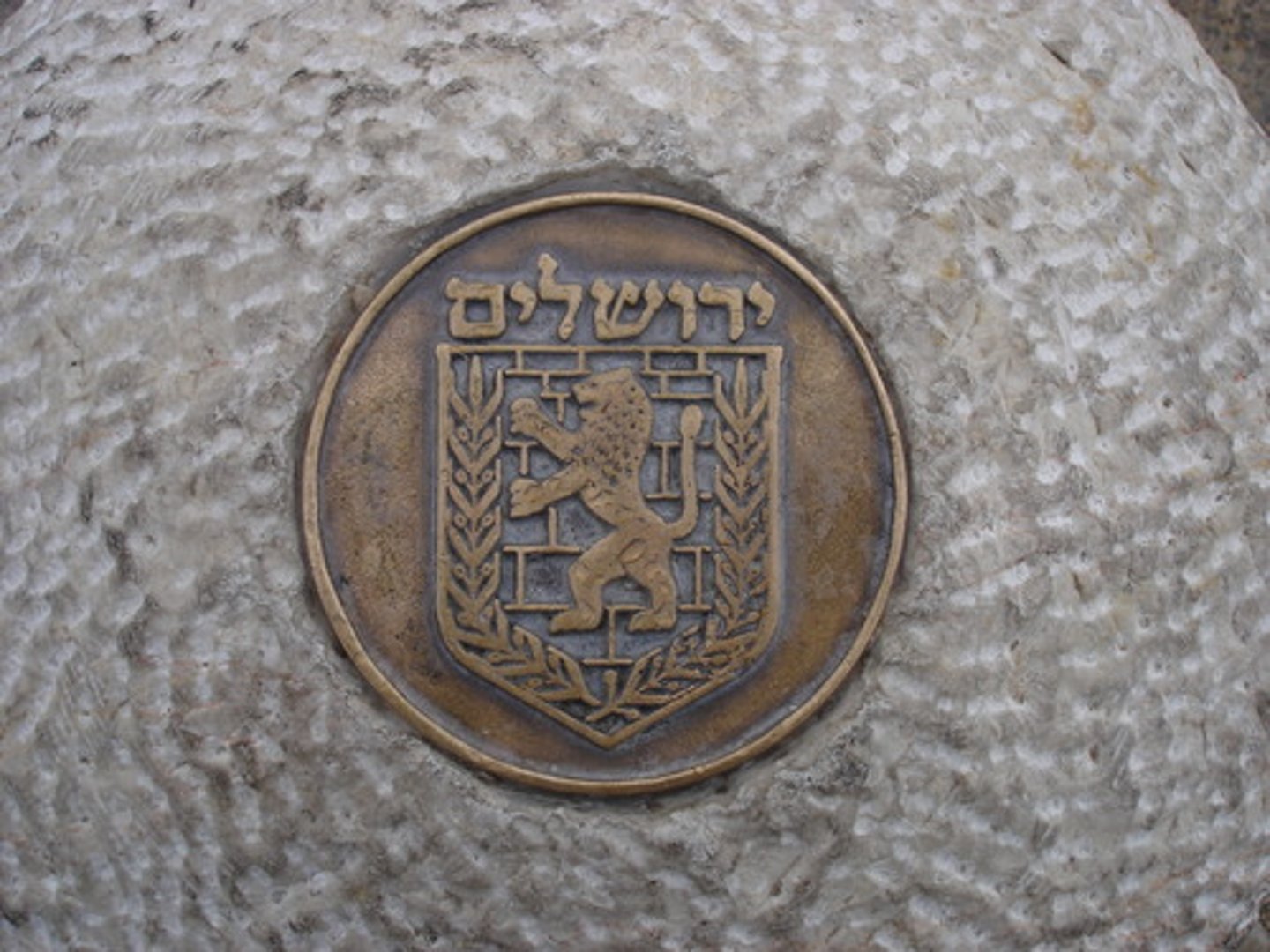 <p>a usually oval or circular tablet, often bearing a figure or ornament in relief</p>