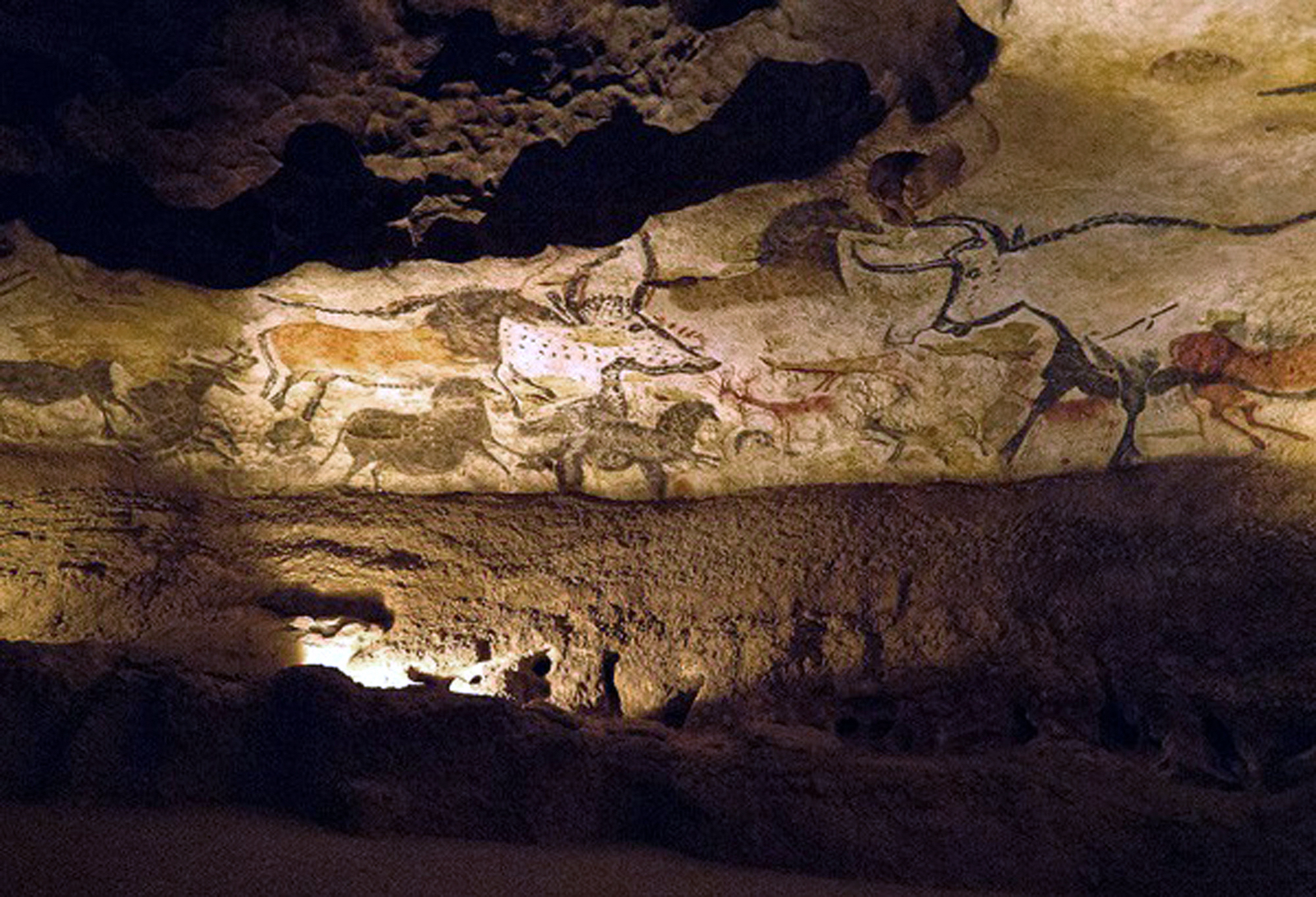 <p>This prehistoric artwork is located in the Lascaux Caves of France. It features a collection of animal paintings, including bulls, horses, and deer.</p>