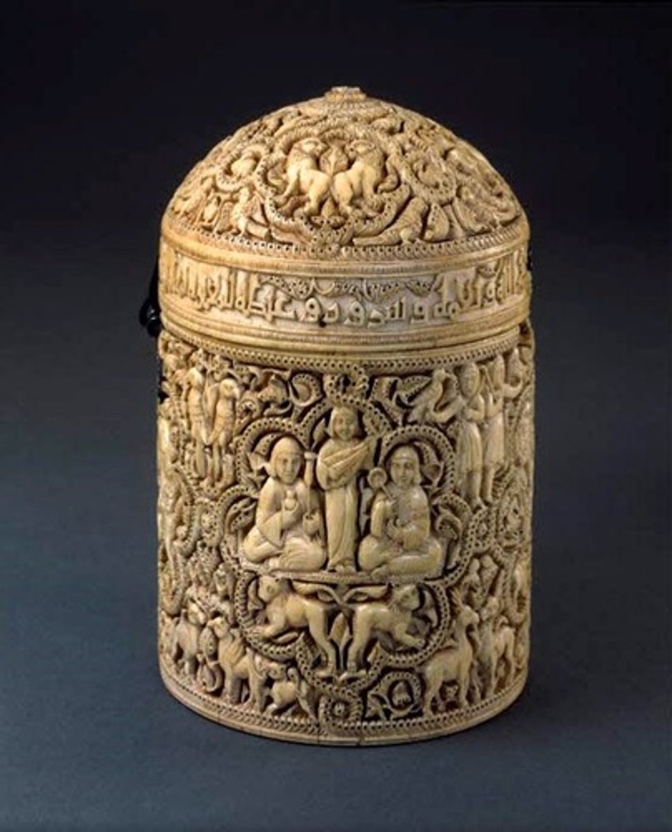 <p>Umayyad. c. 968 C.E. Ivory.<br><br>The Pyxis of al-Mughira is among the best surviving examples of the royal ivory carving tradition in Al-Andalus (Islamic Spain). It was probably fashioned in the Madinat al-Zahra workshops and its intricate and exceptional carving set it apart from many other examples; it also contains an inscription and figurative work which are important for understanding the traditions of ivory carving and Islamic art in Al-Andalus.</p>