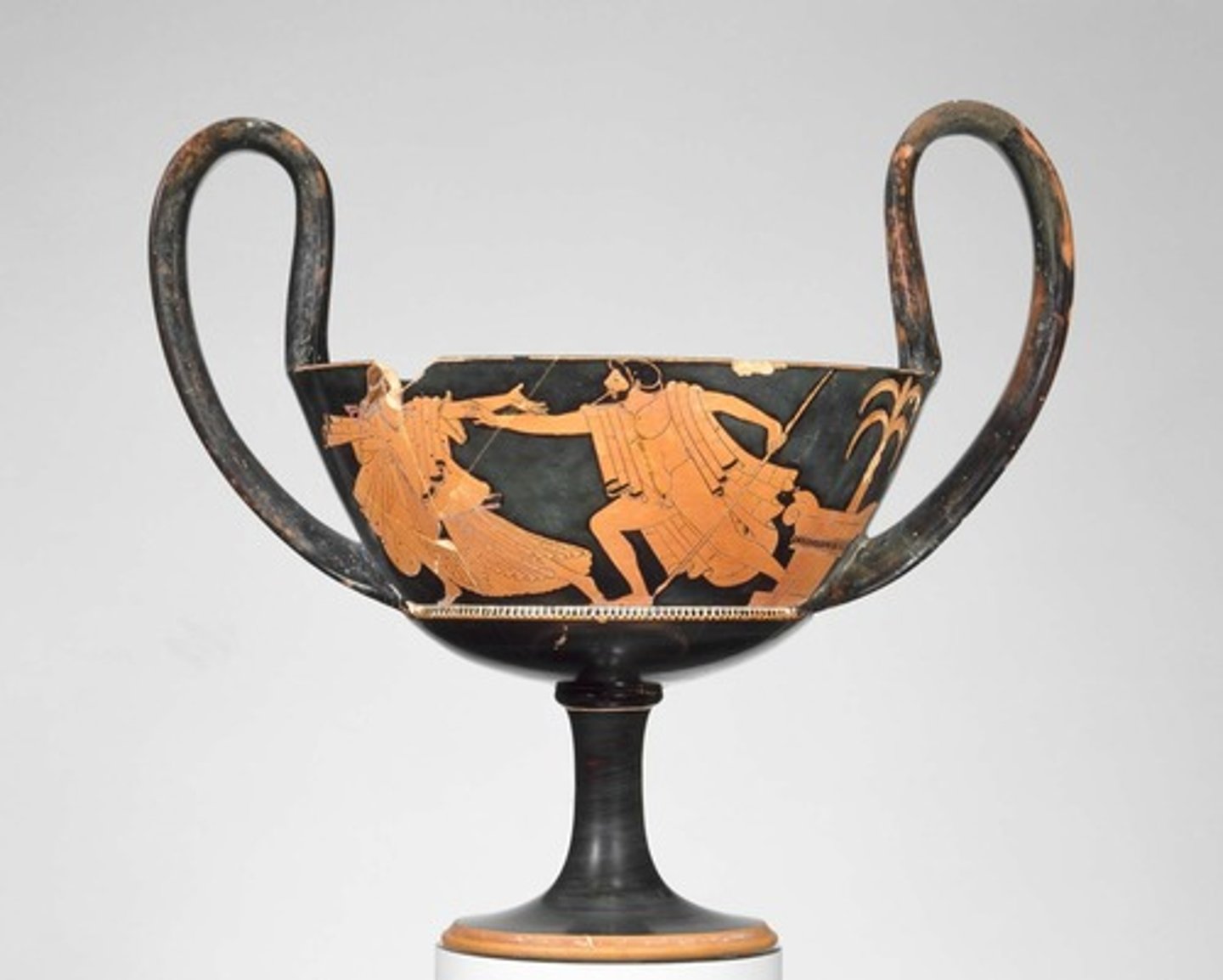 <p>A deep drinking bowl, a tall pedestal foot, and a pair of high vertical handles. Used for drinking wine and ritual purposes. Wine cup used by Dionysus.</p>