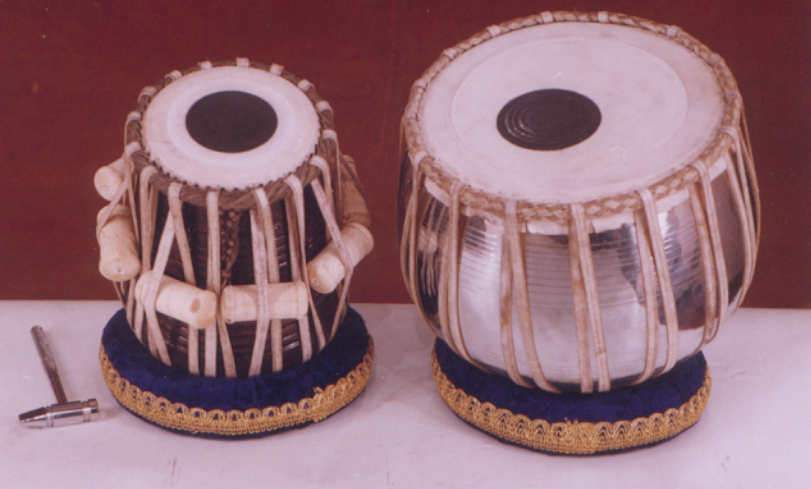 <p>A pair of hand drums used in Hindustani music, characterized by complex rhythmic patterns.</p>
