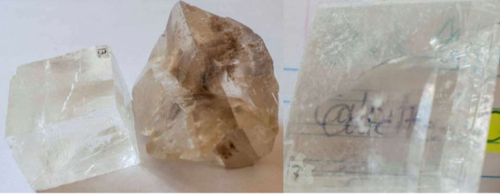 <p>CaCO_3      excellent rhombohedral cleavage. Double refraction. Sft, easily scratched. REACTS W HCl.</p>