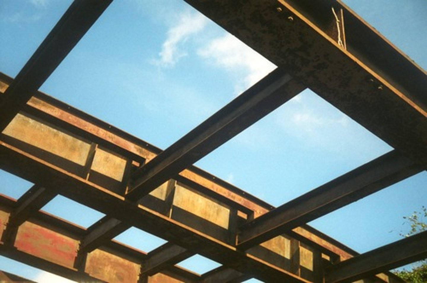 <p>A Concrete beam designed to act together with longitudinal and web reinforcement in resisting applied forces, formed and placed along with the slab they support</p>