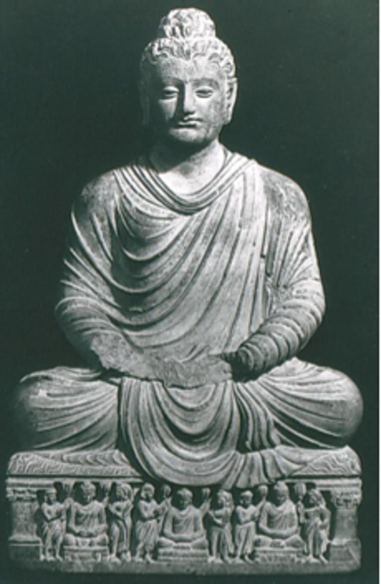 <p>Culture: Gandhara (eastern Afghanistan/western Pakistan)</p><p>Medium: Bronze statuette</p><p>Style: Hellenistic influence - shows cross-cultural exchange after Alexander's conquest</p><p>Features: Mustachioed Buddha, cross-legged, right hand in welcome gesture (abhaya mudra), sun-burst halo</p><p>Historical Context: Gandhara as crossroads of cultures and goods</p><p>Artistic Influence: Similar to early Christian art - both traditions influenced by Hellenistic artists</p>