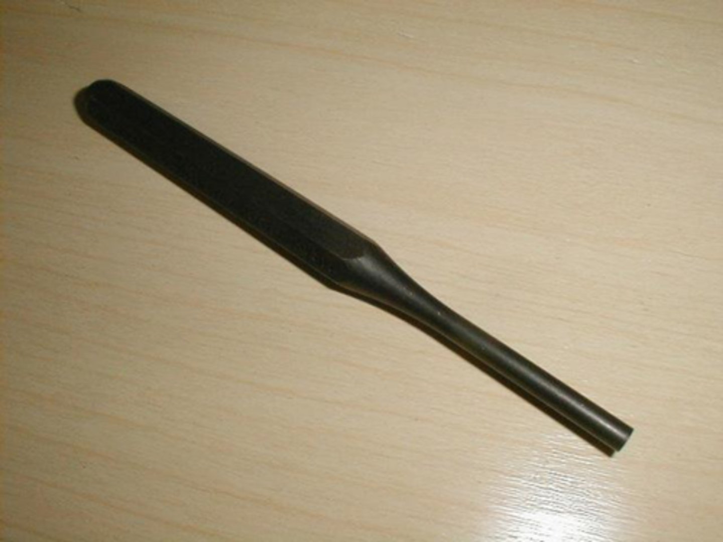<p>driving out metal pins</p>