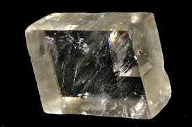 <p>The pictured mineral can be scratched with a penny. What is it likely to be?</p><ol><li><p>Calcite</p></li><li><p>Feldspar </p></li><li><p>Quartz</p></li><li><p>Kyanite</p></li></ol>