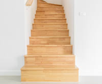 <p>a set of stairs and its surrounding structure, used to go up or down between floors.<br></p>