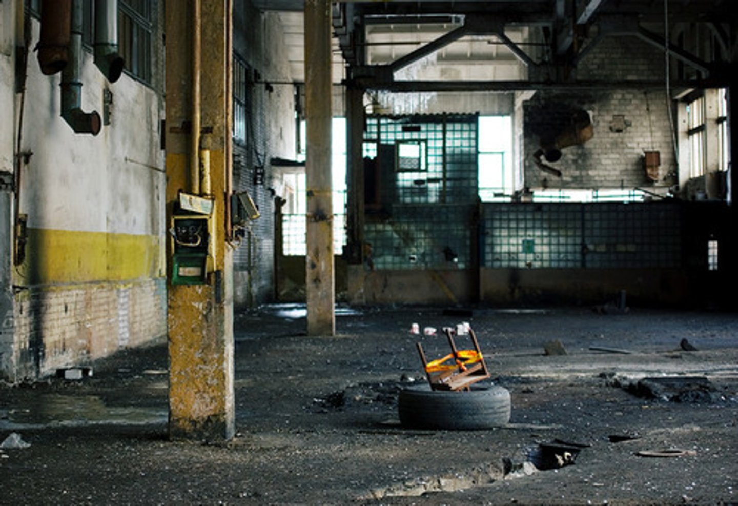 <p>Process by which companies move industrial jobs to other regions with cheaper labor, leaving the region to switch to a service economy and work through a period of high unemployment</p>