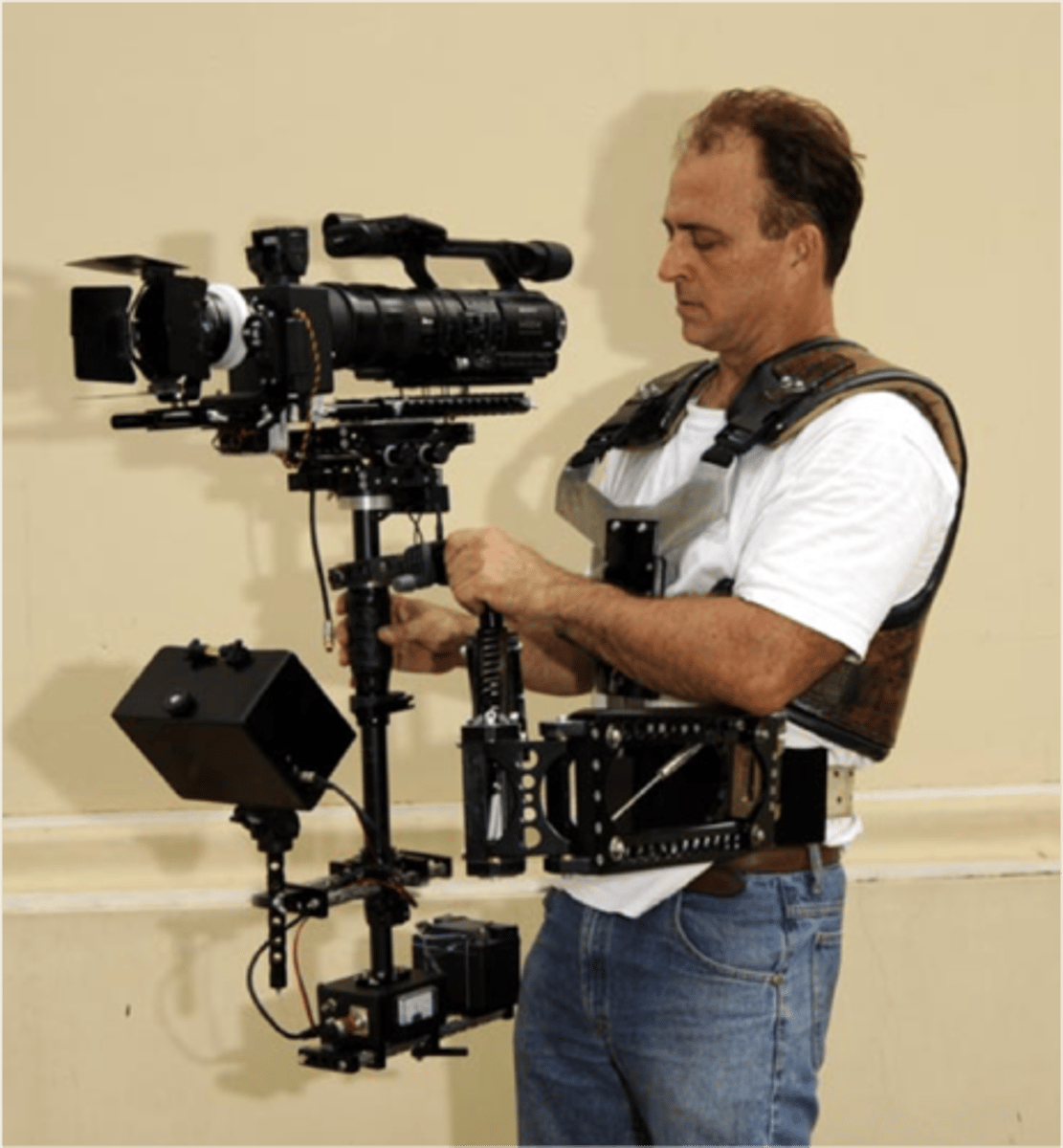 <p>Camera that is physically held by the operator, rather than mounted on a dolly, tripod, or other platform. Permits freedom of movement and is often deliberately shaky.</p>