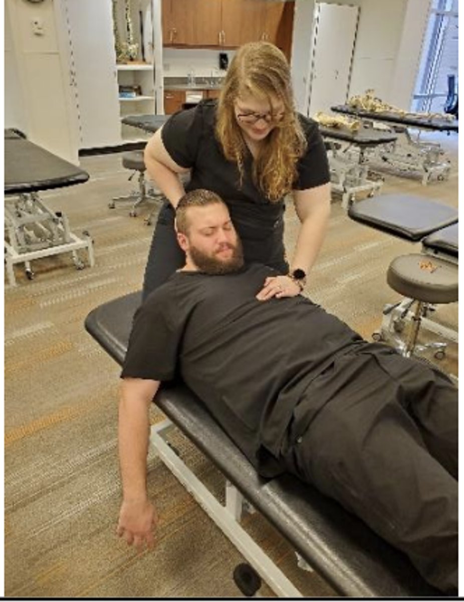 <p>F (arms down and hanging off table)</p>