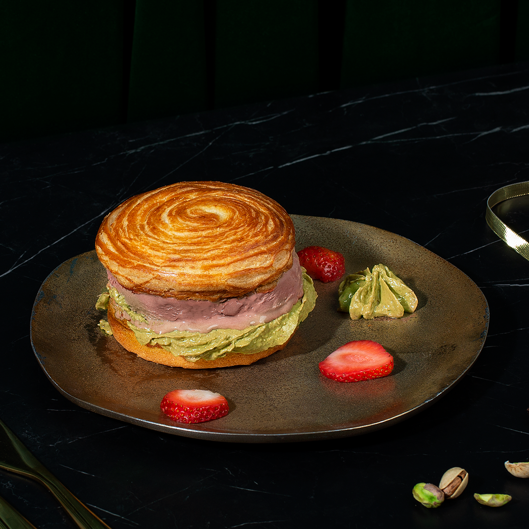 <p>Chocolate cashmere ice cream</p><p>Strawberry garnish</p><p>Pistachio kunafa</p>