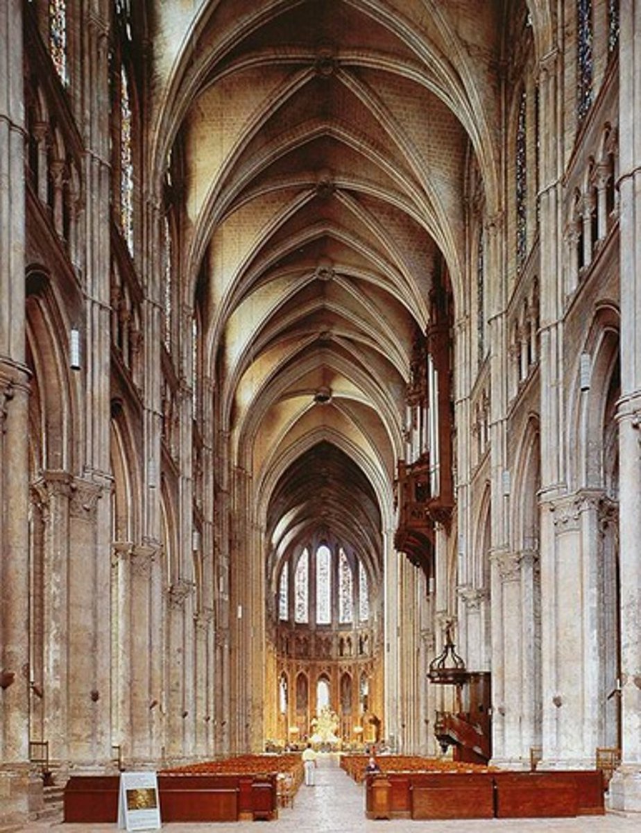 <p>Nave wall layout: Nave arcade, Triforium, Clerestory windows (with stained glass); not as elaborate rose window, incredible stained glass work.</p>