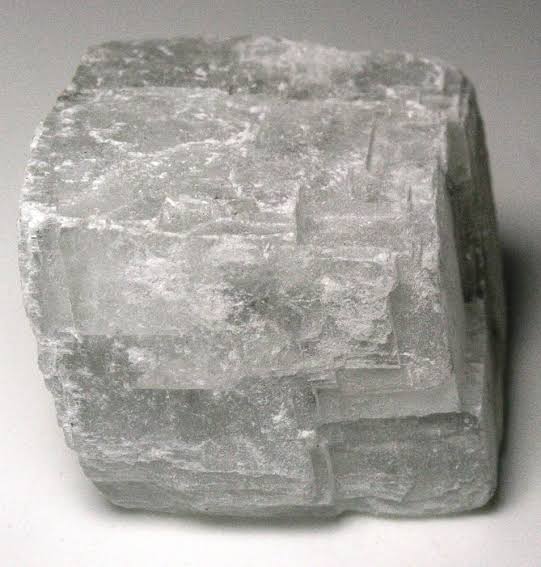 <p>Cleavage where the mineral breaks in three directions (also identify mineral)</p>