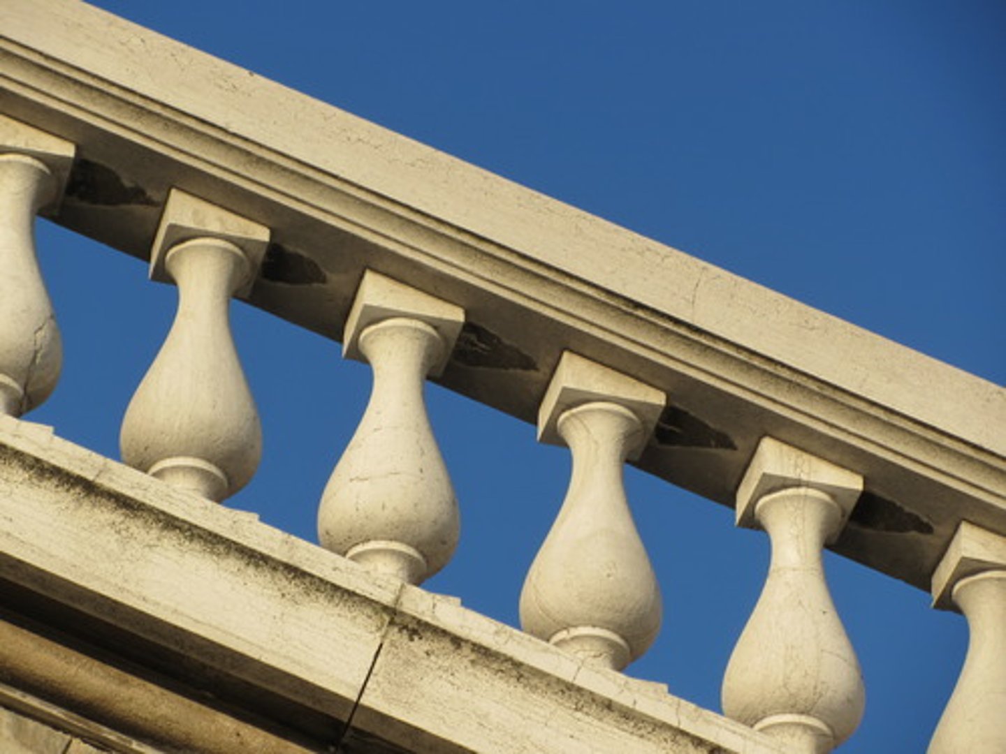 <p>Railing composed of a series balusters, bottom rail and top handrail, also used to smaller scale to embellish furniture</p>