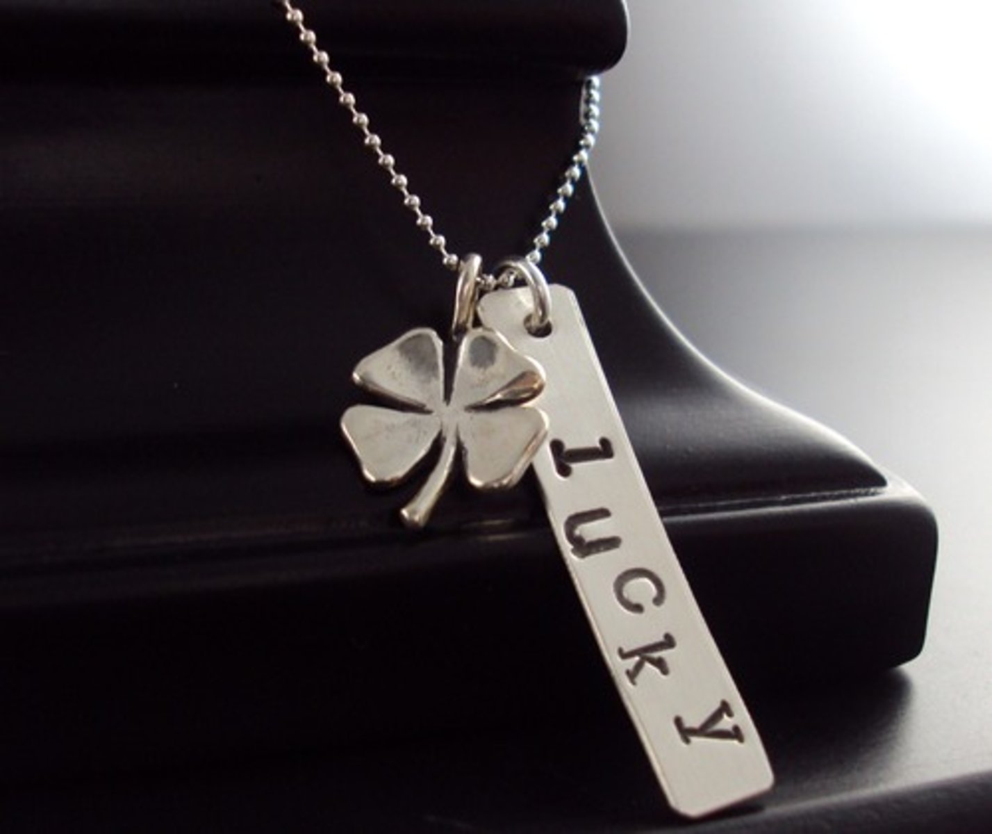 <p>(n.) an object that serves as a charm or is believed to confer magical powers, an amulet, fetish</p>