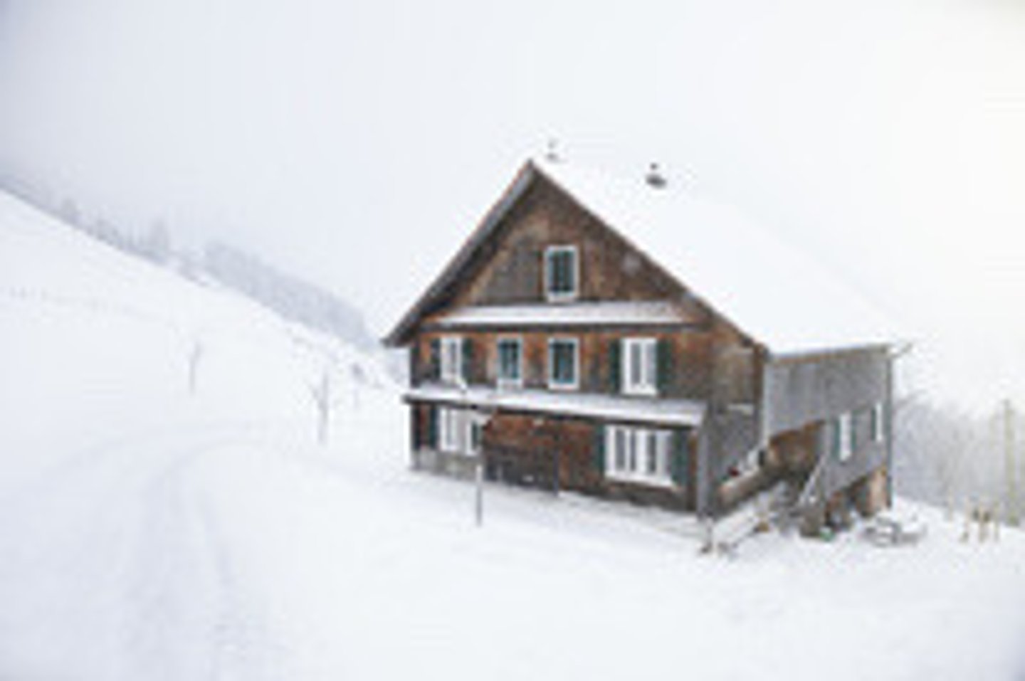 <p>a small wooden house found in mountain areas, especially in Switzerland, or a house built in a similar style, especially one used by people on holiday</p>