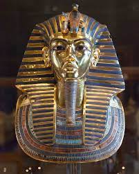 from the innermost coffin in his tomb at Thebes, Egypt, 18th Dynasty
ca. 1323 BCE. 
Gold with inlay of semiprecious stones