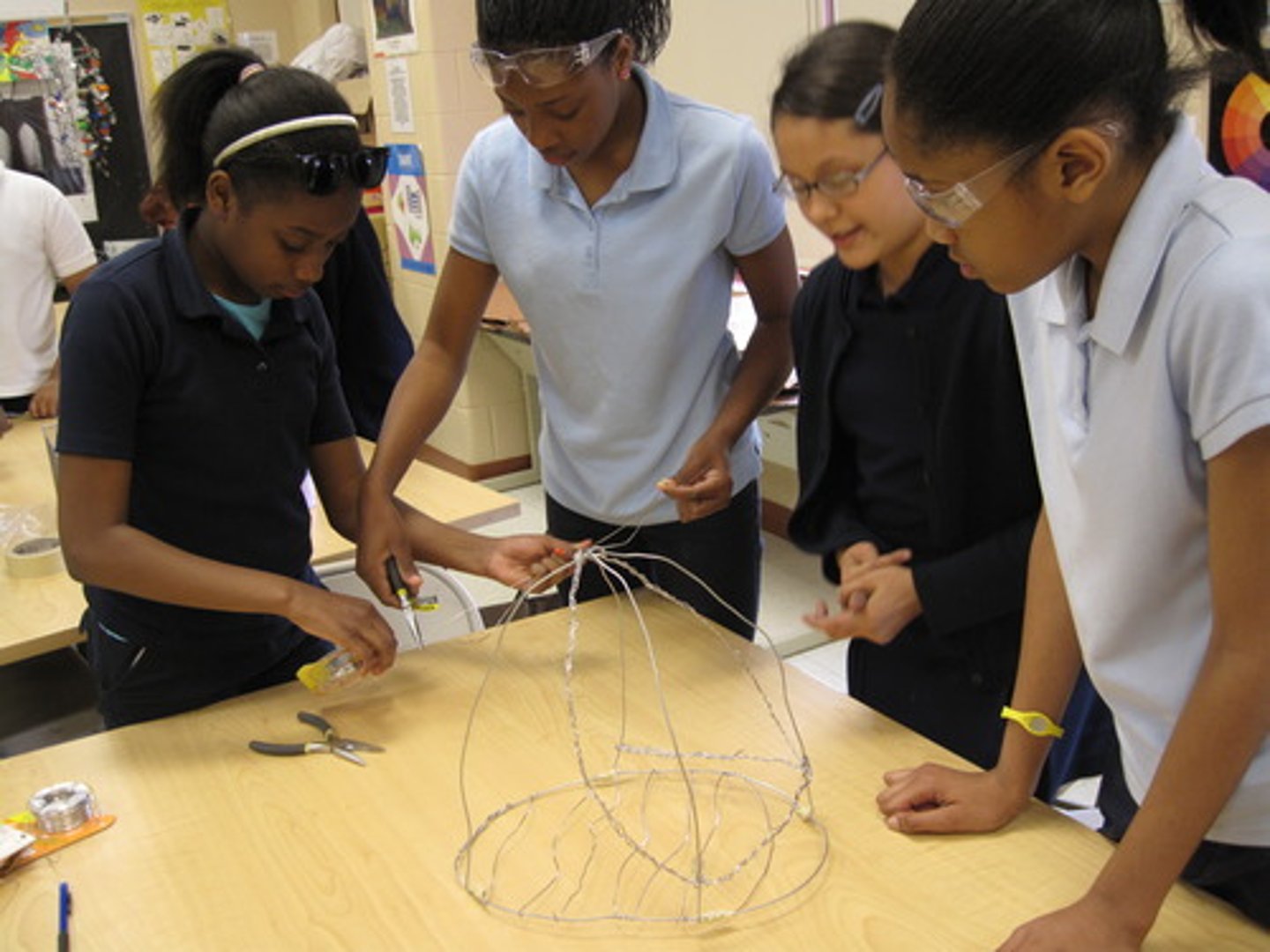 <p>v. to work with another toward a goal</p>