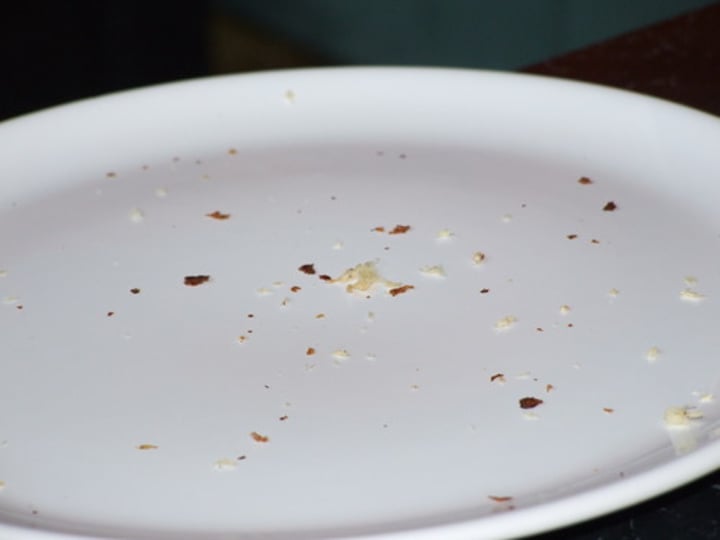 <p>a very small piece of food, especially of bread or cake, that has fallen off a larger piece<br>-She stood up and brushed the crumbs from her sweater.<br>a small piece or amount<br>-I managed to pick up a few crumbs of useful information.<br>-If you're gonna study, you can use that table. Just don't leave the place covered in eraser crumbs, all right?</p>