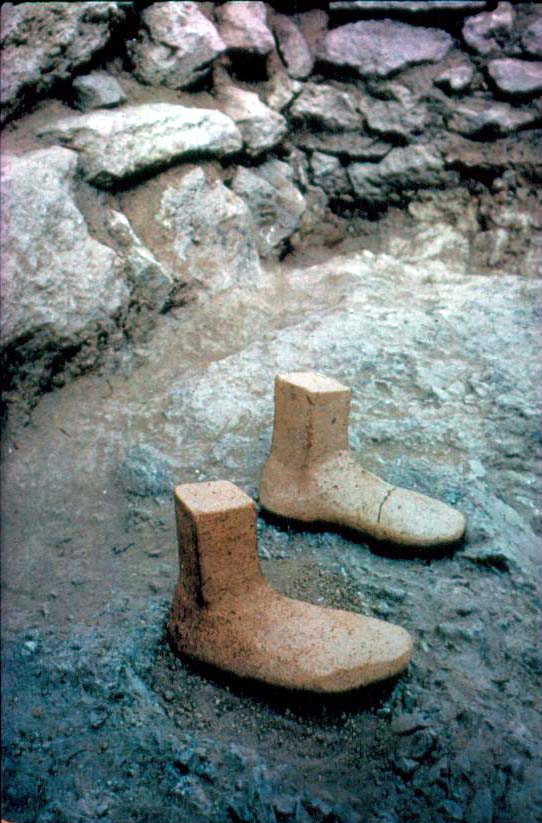 <p>The feet of what may have been a cult statue in the “Temple” building of</p>