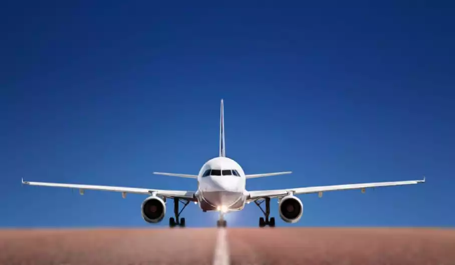 to arrive on the ground or other surface after moving down through the air
