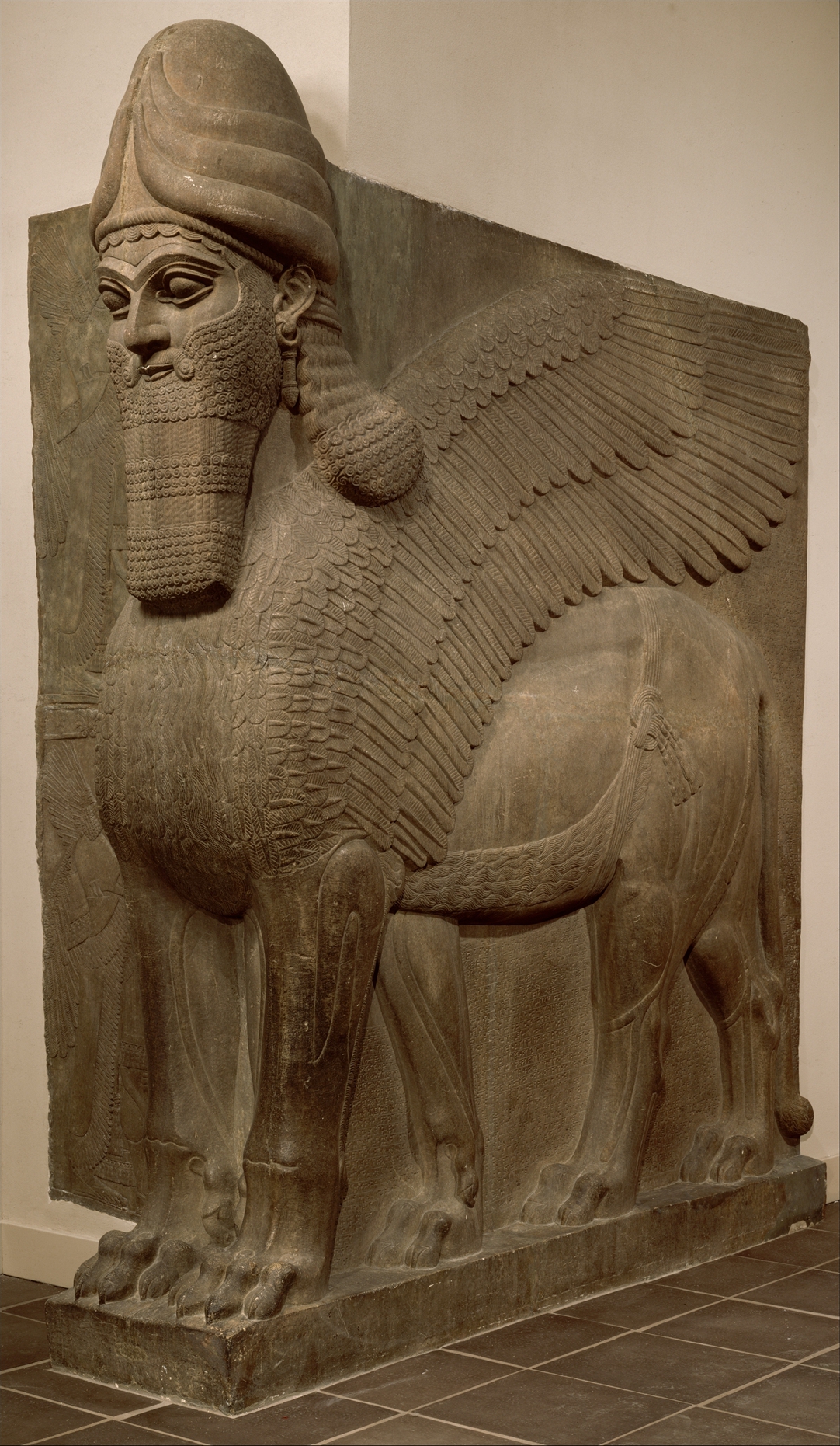 A statue that depicts an animal hybrid with the head of a man and a body of either a lion or bull. They are seen as mystic and wise beings in mythology. 