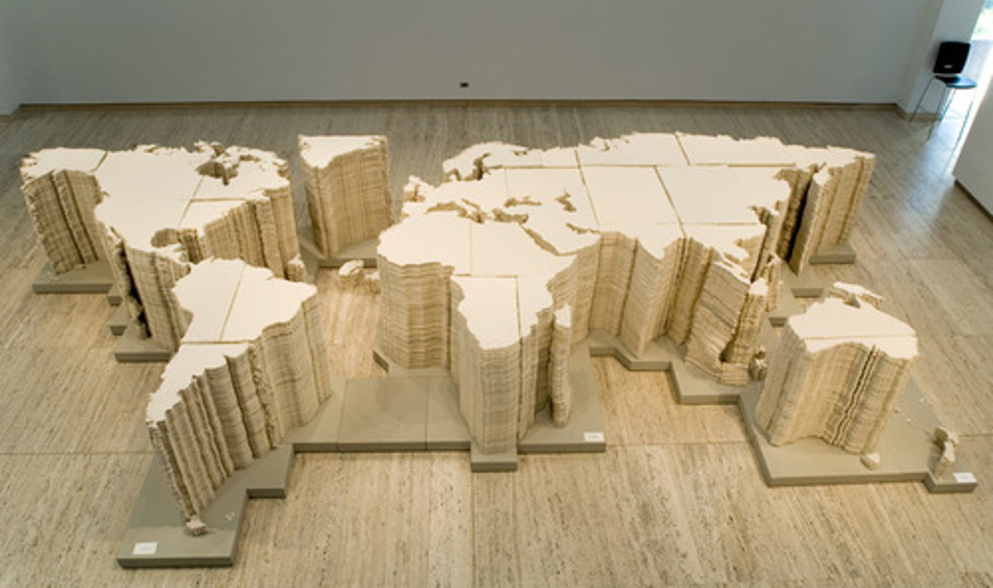 <p>Title: World Map</p><p>Time: 2006.</p><p>Known for:</p><ul><li><p>A <strong>large-scale map of the world</strong> made entirely from <strong>pieces of tattered leather</strong>, hand-stitched together and laid flat on the floor.</p></li><li><p>Symbolizes the <strong>fragmentation and artificial construction of national boundaries</strong>, questioning the meaning of <strong>global unity</strong> in the face of <strong>conflict, inequality, and migration</strong>.</p></li><li><p>Reflects their broader concerns with <strong>freedom, human rights</strong>, and <strong>geopolitical power structures</strong>, especially in relation to China’s position in the world.</p></li></ul><p></p>