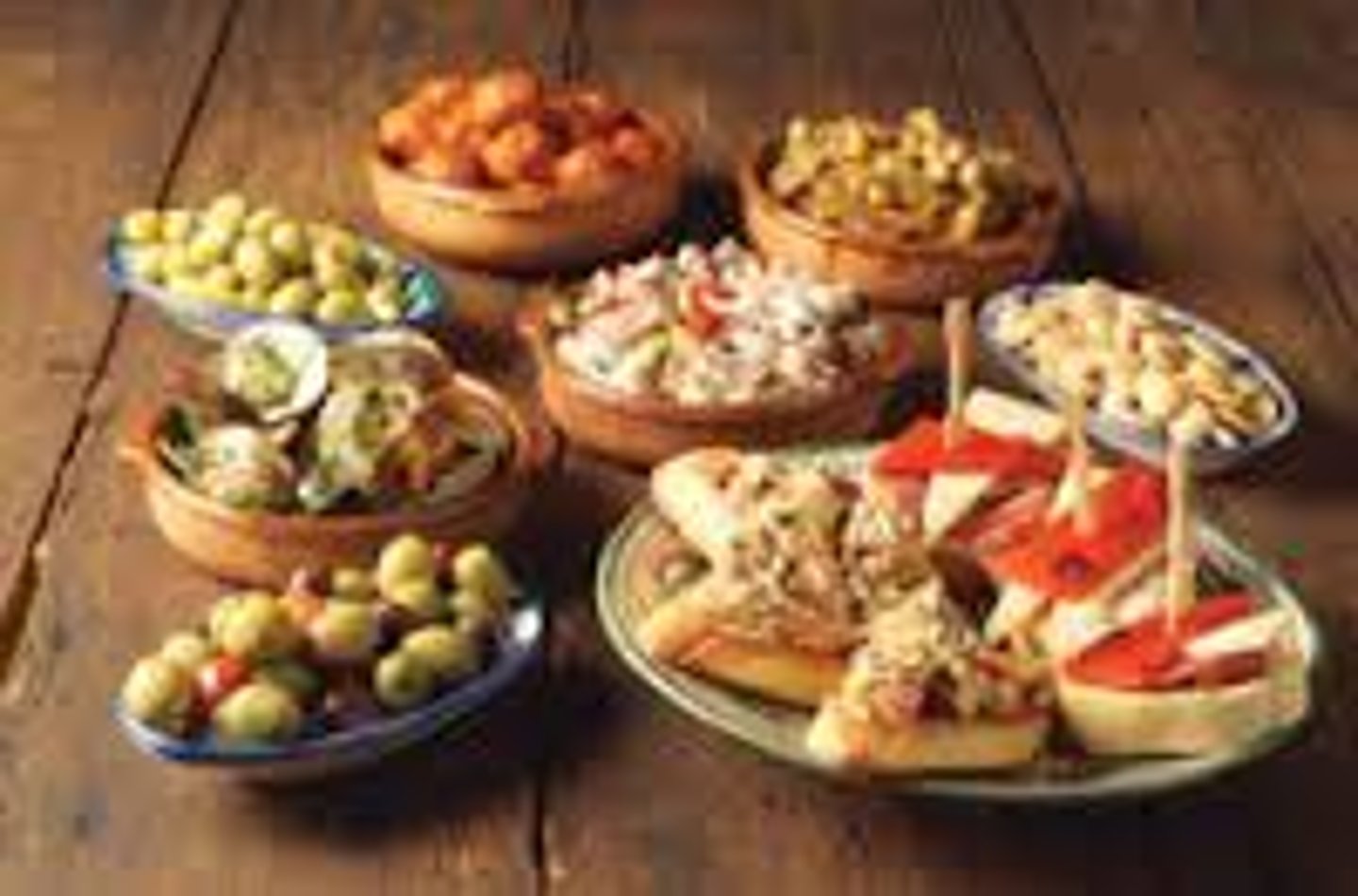 <p>Traditional Spanish snack foods like ham, olives, croquettes, calamares (fried</p><p>squid), etc. eaten all day in the "casetas" at the fair.</p>