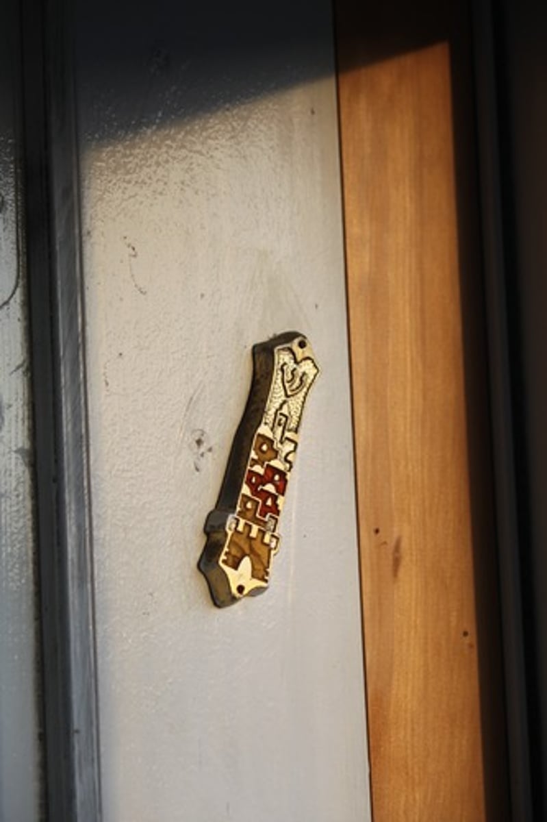 <p>door post, piece of parchment that contains shema prayer rolled up and placed in cntainer attatched to doorway of home</p><p>-stricter branches have it on every doorway</p><p>-will touch/kiss it upon entry and exit to show reverence of most sacred prayer</p>