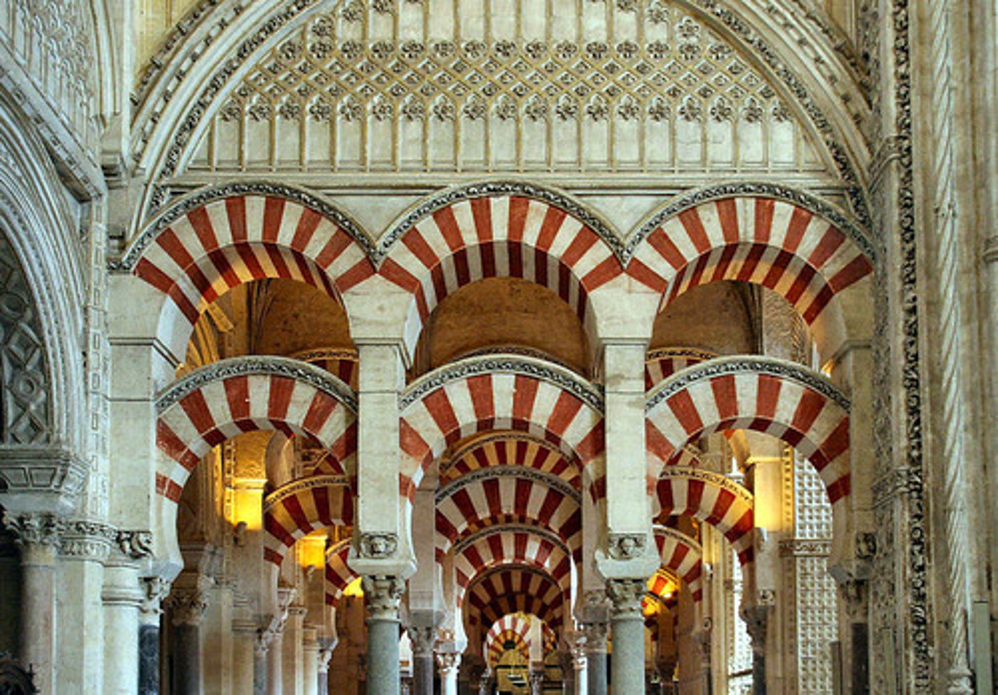 <p>Known for its prayer hall with double arcades, lower arches are of horseshoe form and have voussoirs of white stone and red brick. Has 860 columns. (Spain)</p>