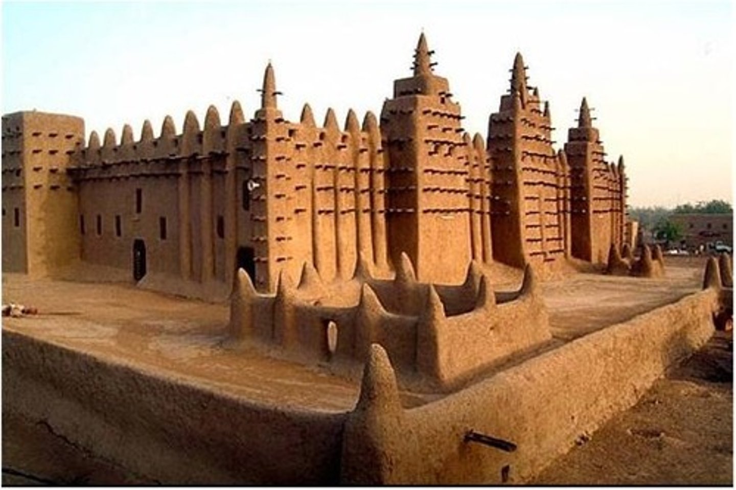 <p>MALI!!! Adobe<br><br>INFLUENCE BY ISLAM!<br>Third mosque, Djenne is a cultural+intellectual center<br>Location for practice of islam!!<br><br>Mudbrick and adobe plaster, wooden scaffolding (like mesa verde)<br>Lots of upkeep, annual festival to do that<br>Vertical fluting is to keep water off<br>3 ower,s mihrab in middle! Terracotta lids ventilate space<br>HYPOSTLE HALL for heavy roof! <br>Ostrich egg motif = PURITY<br>TORONS wooden skeleton + maintenance access</p>