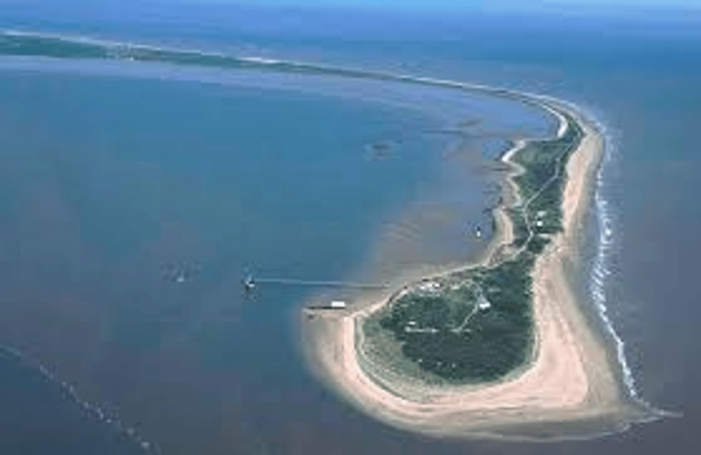 <p>= a peninsular spit, site of special scientific interest which attracts tourists from all around the world and protects estuary from erosion<br><br>145 acres in 1945, now only just over half that size</p>