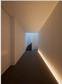 <p>a strip light is</p><p>placed against the floorwhere a deflector</p><p>directs the light upward or perhaps</p><p>downward, givingthe effect of theatrical</p><p>usher lights.</p>