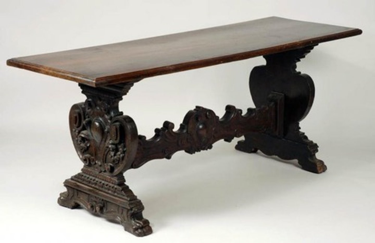 <p>Gothic</p><p>long, narrow table, like the tables used in a monastery or college dining hall; having a single stretcher between trestle like supports in the end</p>