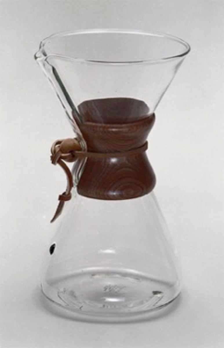 <p>Was a chemist and designer<br>Used laboratory equipment as form inspo<br>handle/collar to not burn hand <br><br>Wood, glass, and rawhide<br>Focuses on the beauty of the vessel, no flaws</p>
