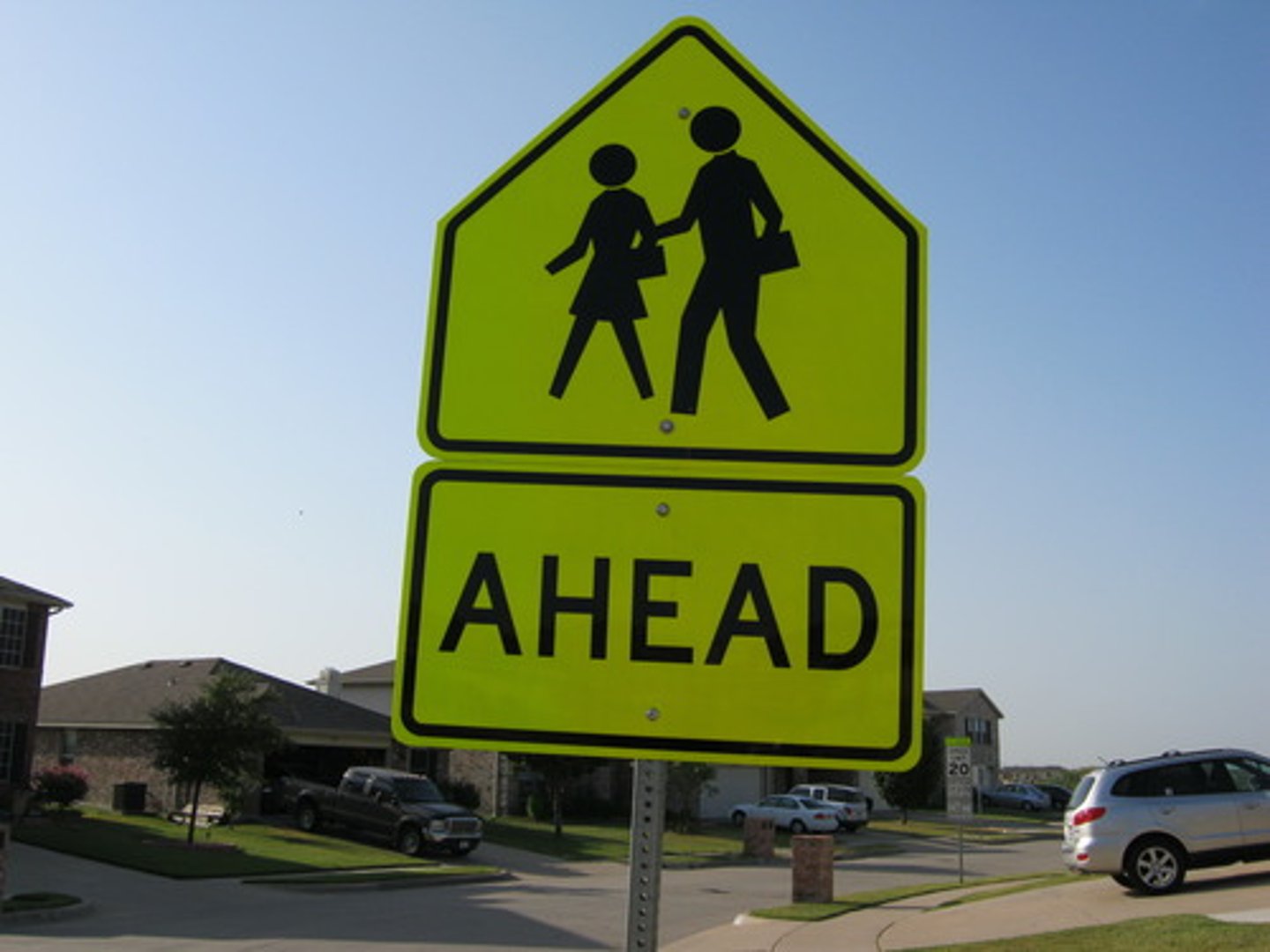 <p>At a school crossing sign, you should:</p><p>Always sound your horn when you see children.</p><p>Be ready to help children crossing the street.</p><p>Watch for children and be ready to stop.</p><p>Always stop, whether there's a stop sign or not.</p>
