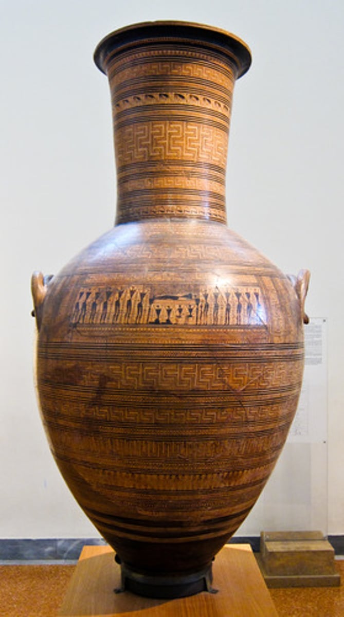 <p>Ceramic funerary vase from the Late Geometric period (ca. 750 BCE) that served as a large grave marker for a female burial, featuring meander patterns and a prothesis scene.</p>