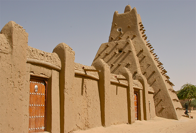 <p><em>One of Timbuktu's three great mosques, Sankor</em>é<em> Mosque, associated with Sankor</em>é<em> University, helped establish Timbuktu as the world center of Islamic learning from the thirteenth century to the seventeenth century.</em></p><p class="dap_caption">&nbsp;</p><p class="dap_body"><span><strong><span>Source 2</span></strong></span></p><p class="dap_body">&nbsp;</p><p class="dap_body">“Timbuktu...was an intellectual and spiritual capital and a centre for the propagation of Islam throughout Africa in the fifteenth and sixteenth centuries. Its three great mosques, Djingareyber, Sankoré and Sidi Yahia, recall Timbuktu's golden age....&nbsp;</p><p class="dap_body">Founded in the fifth century, the economic and cultural apogee<span><sup><span>1</span></sup></span>&nbsp;of Timbuktu came about during the fifteenth and sixteenth centuries. It was an important centre for the diffusion of Islamic culture with the University of Sankoré, with...25,000 students. It was also a crossroads and an important market place where the trading of manuscripts was negotiated, and...gold was sold....&nbsp;</p><p class="dap_body">The mosques and holy places of Timbuktu have played an essential role in the spread of Islam in Africa at an early period; the three great mosques of Timbuktu...bear witness to the golden age of the intellectual and spiritual capital at the end of the Askia dynasty; and the three mosques and mausoleums are outstanding witnesses to the urban establishment of Timbuktu, its important role of commercial, spiritual and cultural centre on the southern trans-Saharan trading route, and its traditional characteristic construction techniques.”</p><p><span>Which of the following explains the significance of the Mali Empire to the discipline of African American Studies?</span></p>