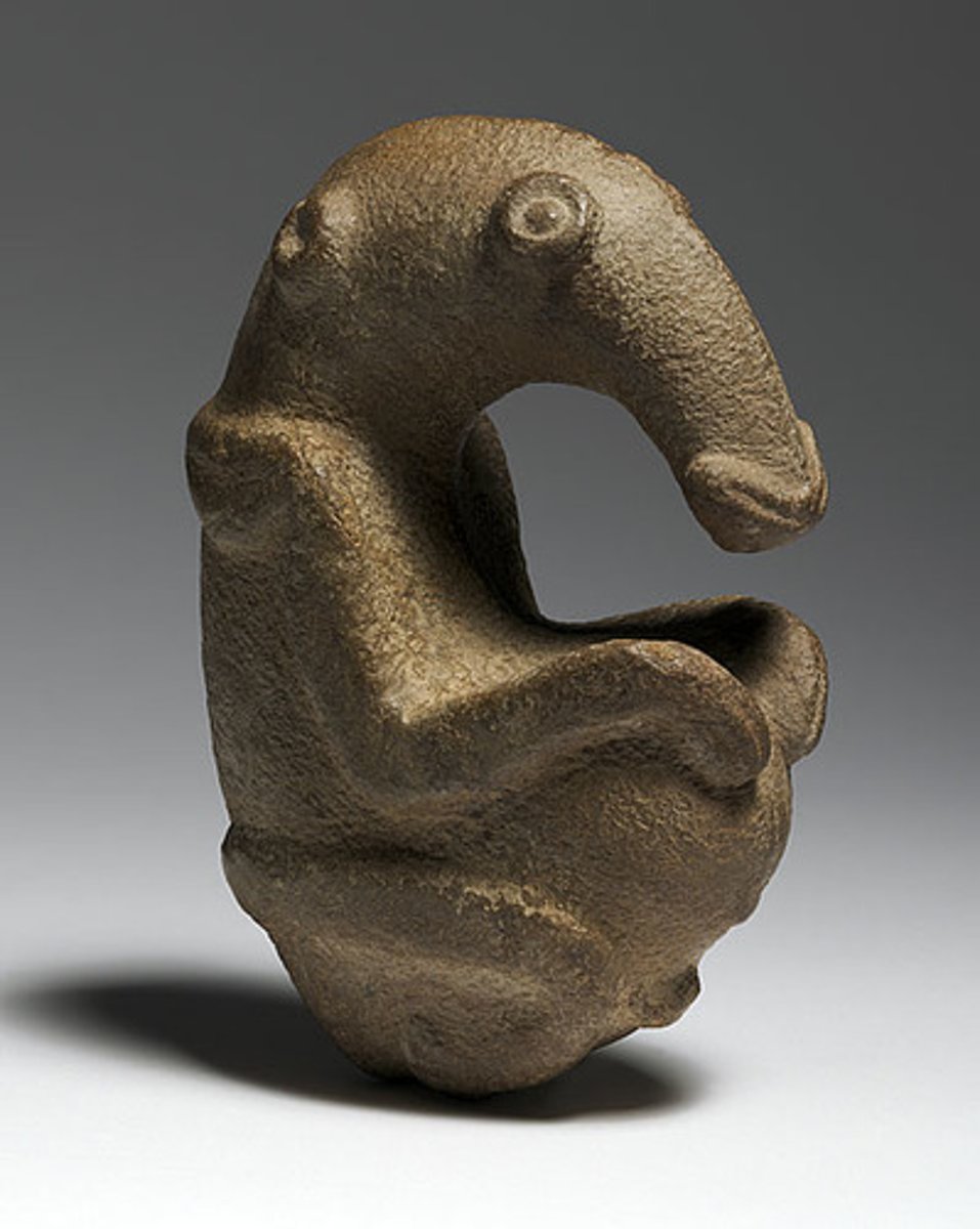 <p>greywacke; Oceanic art;<br>composite: made up of various parts/elements<br>zoomorphic: resembling animals forms; masked human, spirit beings, or ancestors OR anteater embryo in fetal position;<br>stylized art: form that has moved away from natural forms/shapes</p>