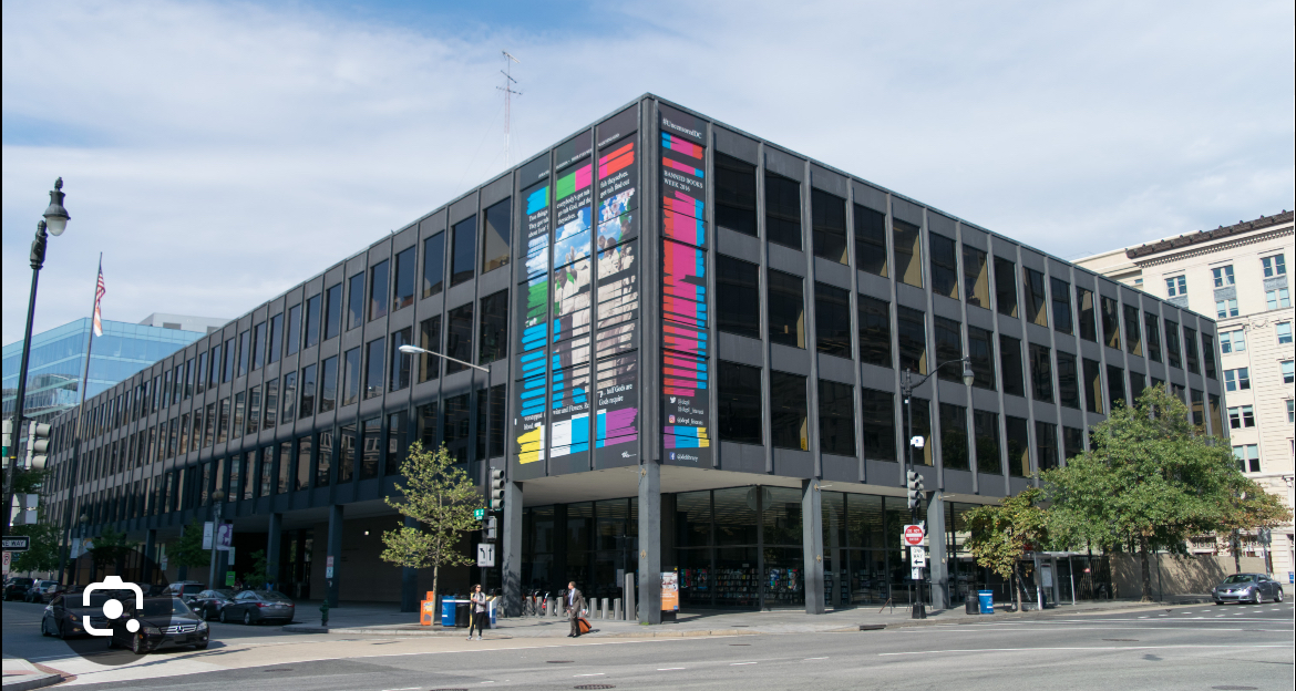 <p><span><span>Rectilinear black steel-and-glass building</span></span></p>