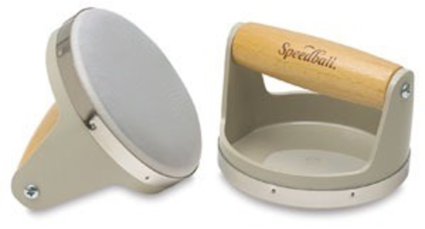 <p>a tool used in relief printing; typically circular or rounded with a flat face, used to transfer ink from block to paper</p>