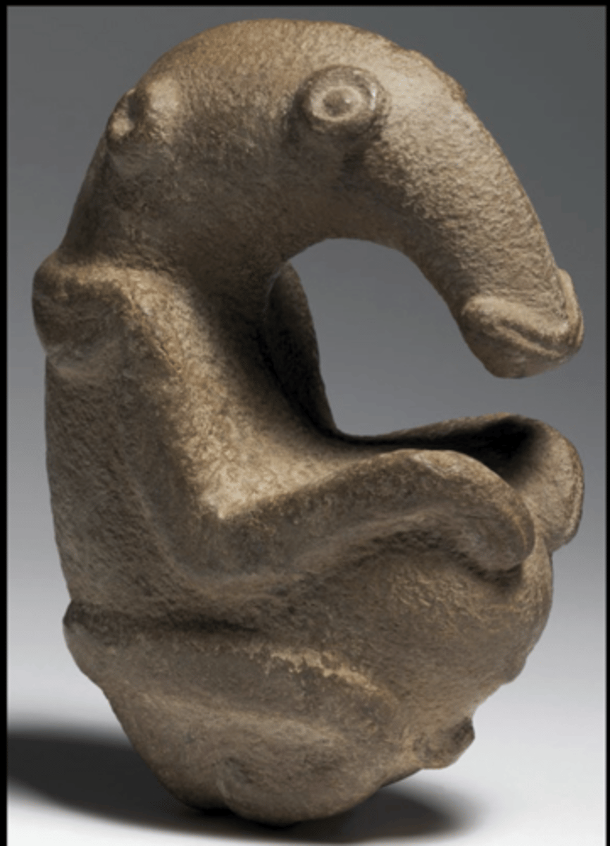 <p>carved greywacke, highly detailed and smooth, zoomorphic (animal form) unknown, used by the Egna people as a ritual object "bones of the ancestors"m used to maintain fertility, when white ppl arrived it became primitive art which diminished their supernatural powers, contains pestles</p>
