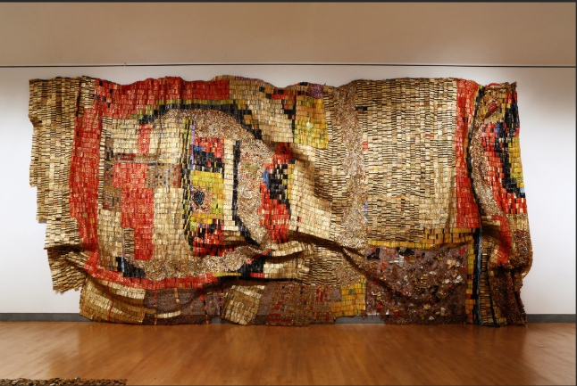 <p>Massive metallic tapestries made from bottle caps critiquing colonialism.</p>
