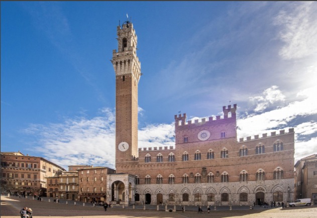 <p>Siena, Italy, 1297, center of the city, made for civic assembly but also some religious ceremonies, at the place where all arteries intersected, so that no one could claim it because it was available to all.   </p>