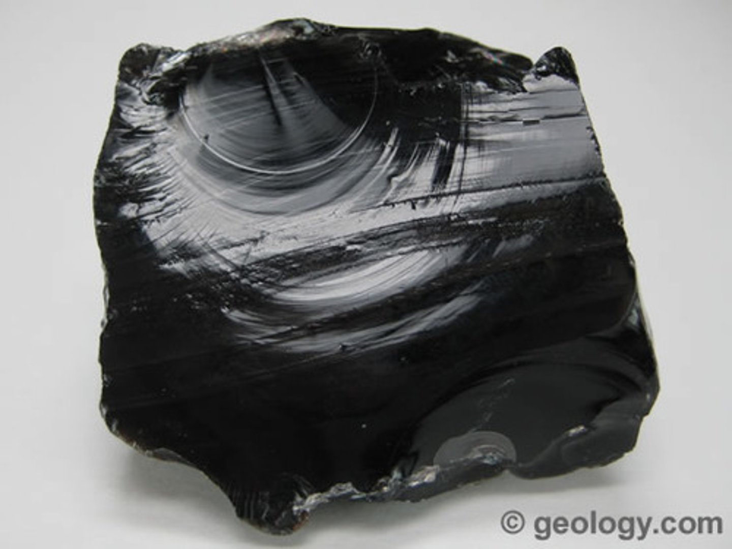 <p>Volcanic glass -- formed extrusively. Dark in color; translucent near edges. Almost entirely SiO2.</p>