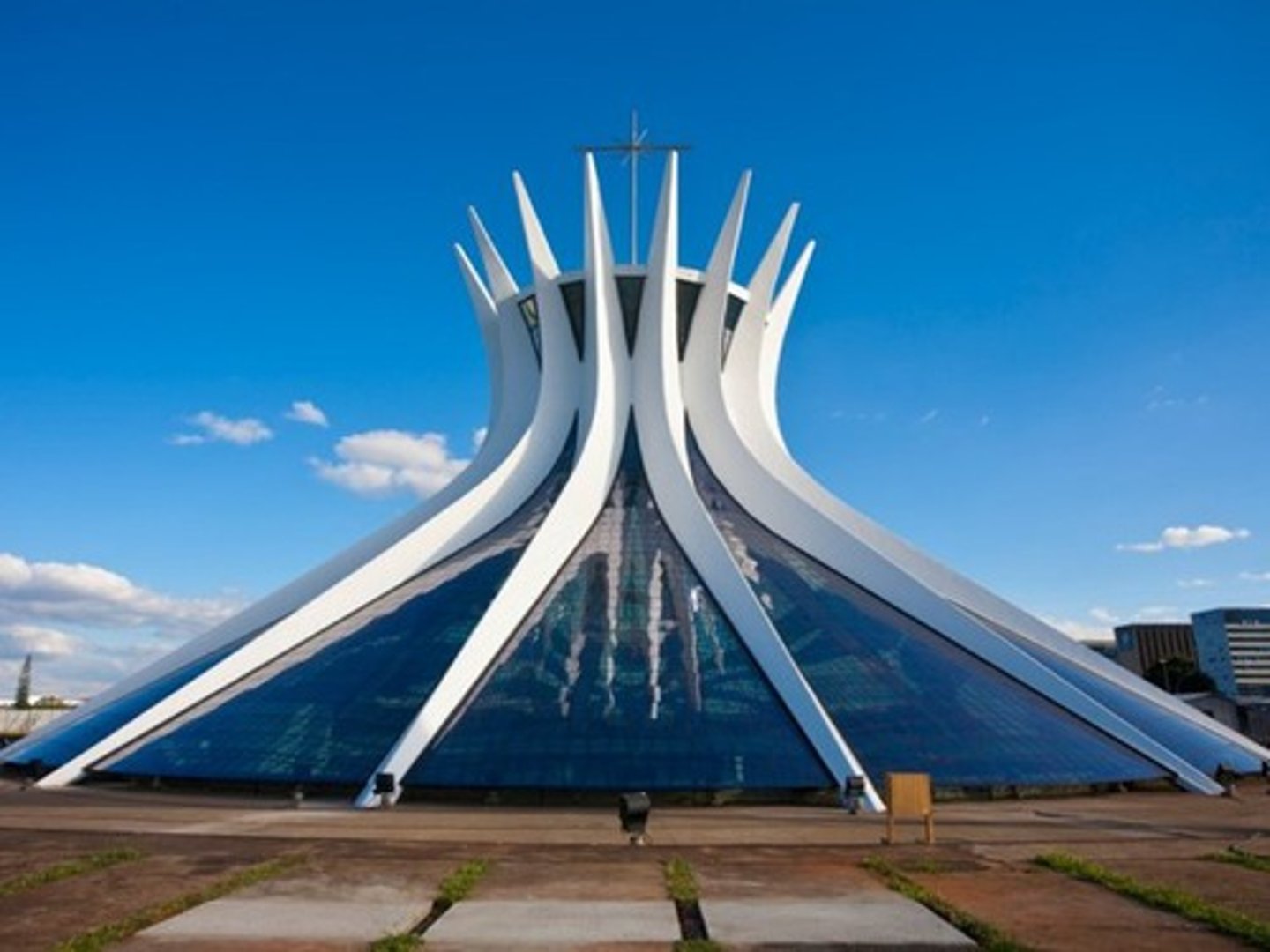 <p>Cathedral designed by Oscar Niemeyer in Brasília, Brazil. The hyperboloid form of curved concrete columns suggests two hands reaching toward heaven. Natural light streams in through stained glass panels.</p>