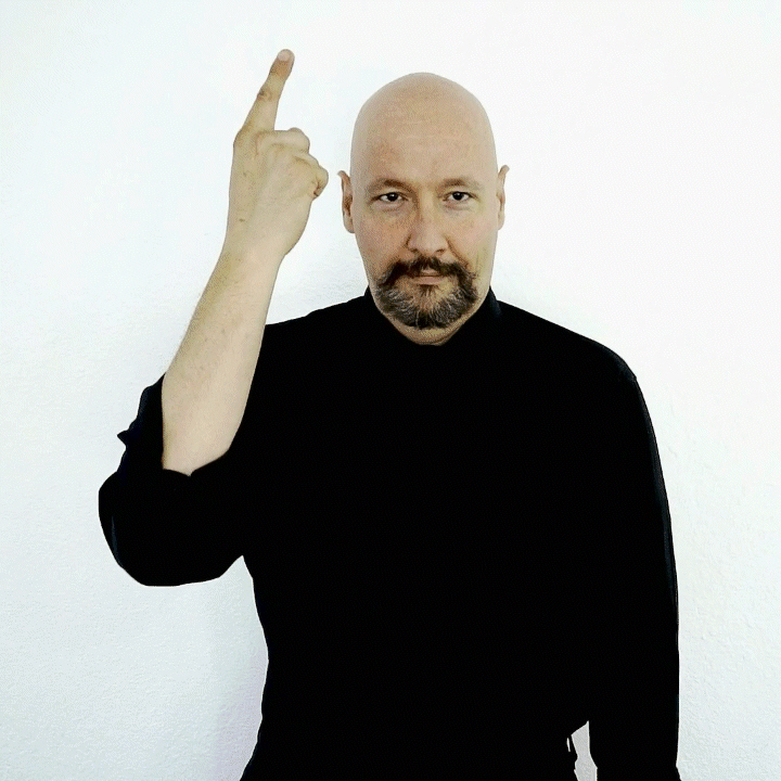 <p><span style="font-size: medium">Hold your hand up near your forehead. Your index finger is bent and the tip of the index finger is touching the pad of your thumb (your thumbprint).&nbsp; Then flick your index finger so that it points up. Think of a "light bulb" turning on in your head</span></p>